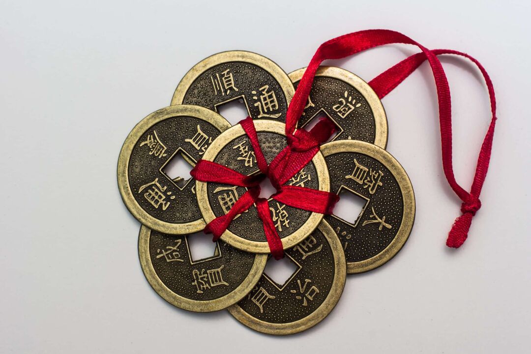 Chinese charms for money with corresponding hieroglyphs