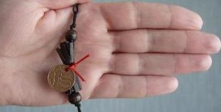 the coin amulet of the shaman